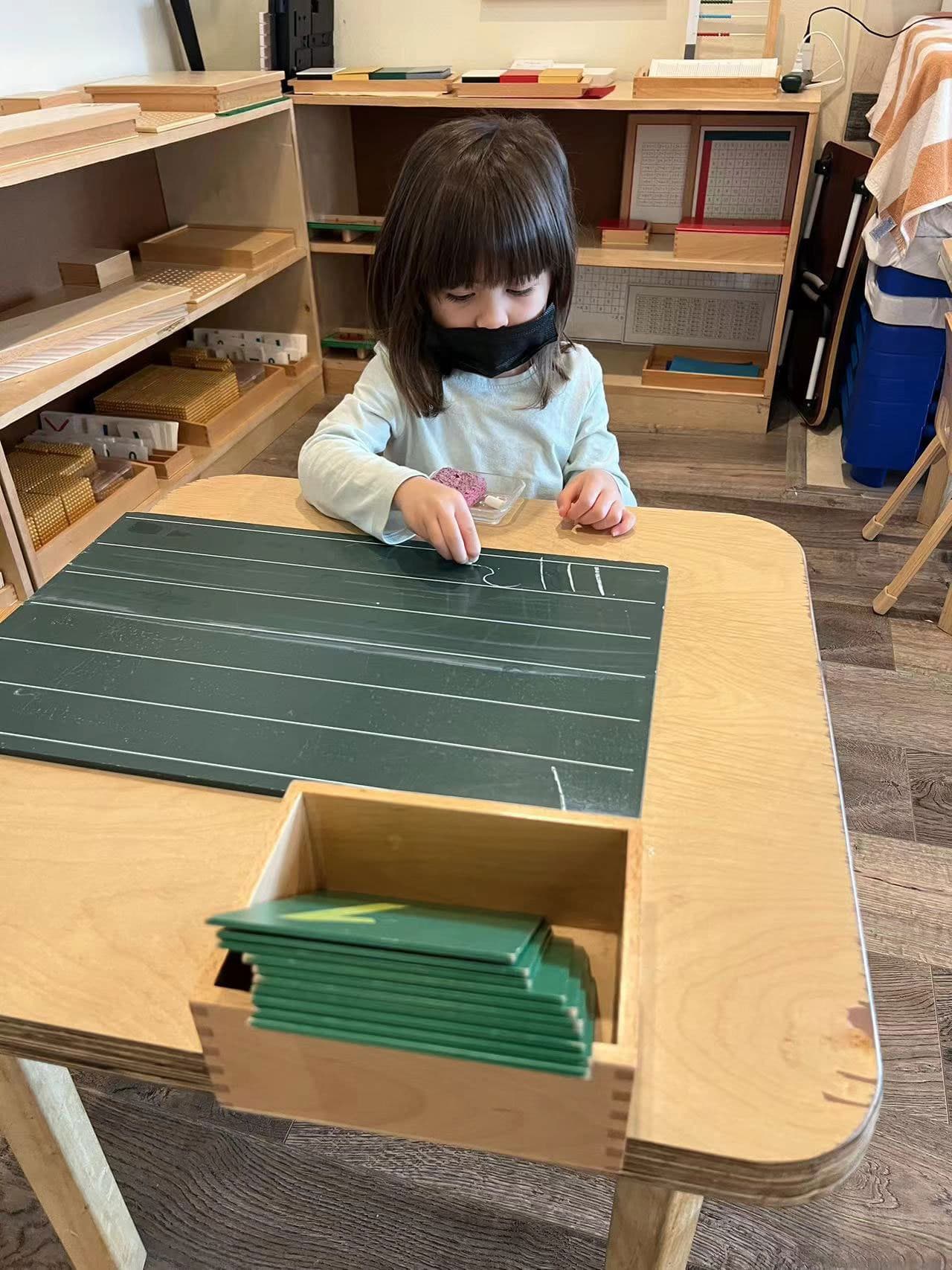 Children exploring learning materials